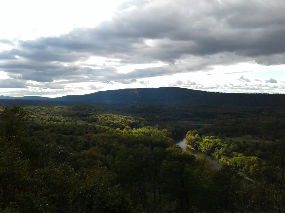 The Potomac River bending through forest below a mountain