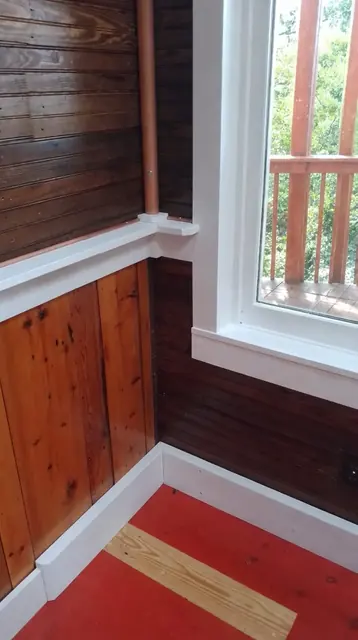 Interior, the corner by the porch window, with the white shelf and copper pipe, the wainscot and the painted red floor, photo 19 of 32