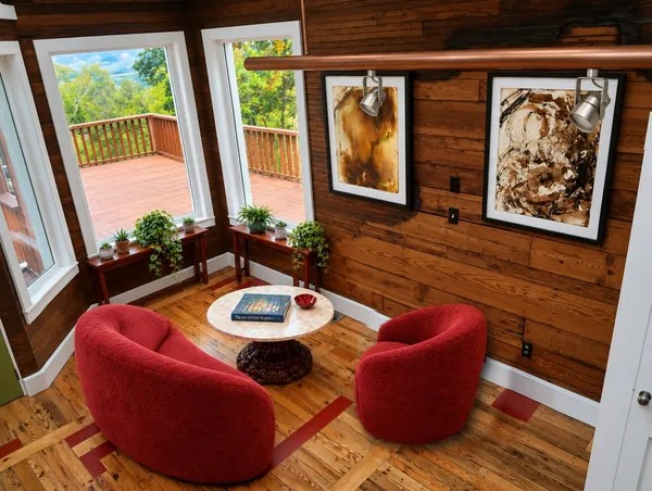Serving suggestion. The corner room furnished with a round marble table, two red chairs and plants on console tables under the tall windows, photo 32 of 32