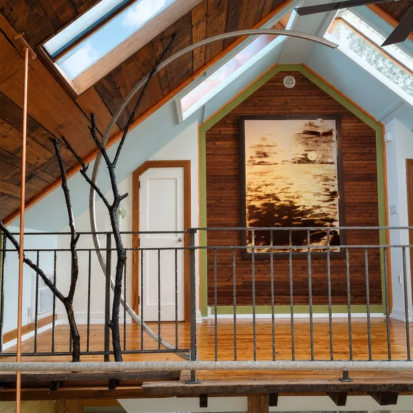 Interior, The loft in daylight, with the framed painting, the bare tree branches and the steel arc, photo 15 of 32