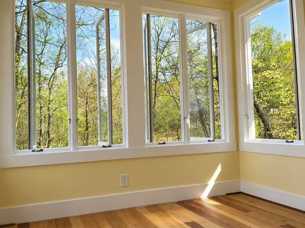 Interior, The bedroom windows, several open to the trees, with the sun on the floor, photo 13 of 32