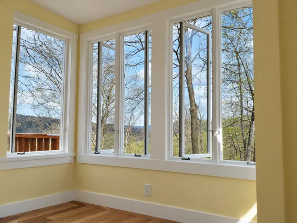 Interior, The sunlit bedroom corner with its casement windows open to the trees, photo 4 of 32