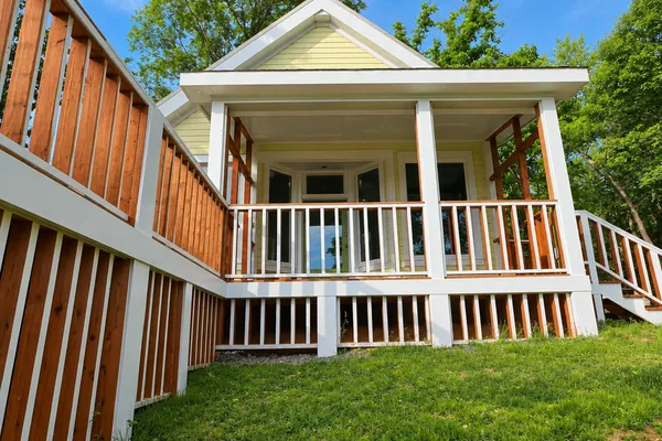 Interior, The screened porch and deck seen from below in late afternoon light, photo 9 of 32