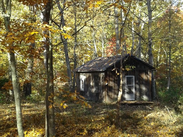 The 1840 schoolhouse in full autumn foliage.